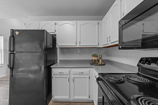 4812 Morecambe Way, Apex, NC 27539 - kitchen with black appliances, a textured ceiling, white cabinets, and backsplash