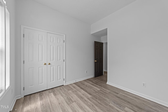 4812 Morecambe Way, Apex, NC 27539 - unfurnished bedroom with wood finished floors and a closet