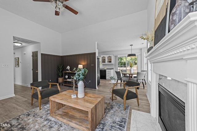 4812 Morecambe Way, Apex, NC 27539 - living room with light wood-style flooring, ceiling fan, and a fireplace