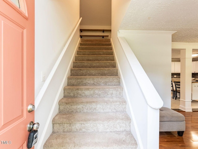 1831 Washington Dr, Hillsborough, NC 27278 - staircase featuring wood finished floors and ornamental molding