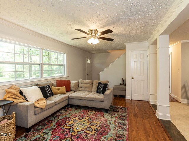 1831 Washington Dr, Hillsborough, NC 27278 - living area with ceiling fan, ornamental molding, a textured ceiling, and wood finished floors