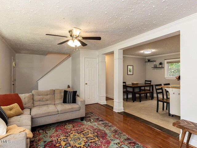 1831 Washington Dr, Hillsborough, NC 27278 - living room with crown molding, a textured ceiling, ceiling fan, dark wood-style floors, and stairway
