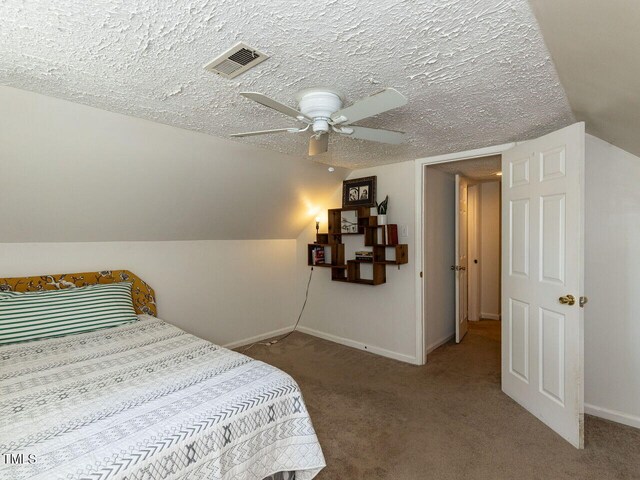 1831 Washington Dr, Hillsborough, NC 27278 - carpeted bedroom featuring lofted ceiling and a ceiling fan
