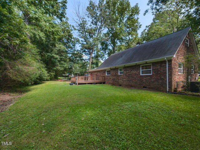 1831 Washington Dr, Hillsborough, NC 27278 - view of grassy yard featuring a wooden deck