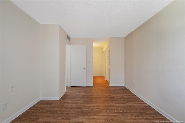 1100 Clarendon St Unit 303, Fayetteville, NC 28305 - empty room with wood finished floors and baseboards
