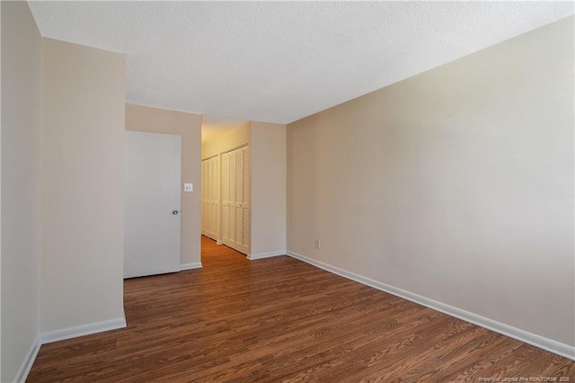 1100 Clarendon St Unit 303, Fayetteville, NC 28305 - spare room featuring wood finished floors and a textured ceiling