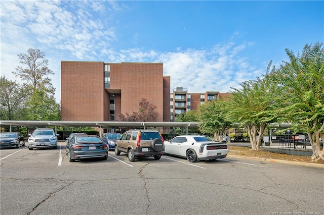1100 Clarendon St Unit 303, Fayetteville, NC 28305 - view of property featuring covered and uncovered parking
