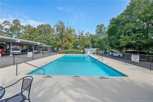 1100 Clarendon St Unit 303, Fayetteville, NC 28305 - community pool featuring view of scattered trees and a patio area