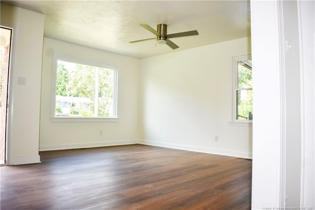 5404 S Sumac Cir, Fayetteville, NC 28304 - unfurnished room featuring dark wood finished floors, healthy amount of natural light, and a ceiling fan