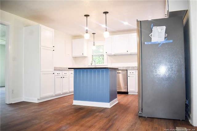 5404 S Sumac Cir, Fayetteville, NC 28304 - kitchen featuring appliances with stainless steel finishes, dark wood finished floors, white cabinetry, a kitchen island, and pendant lighting
