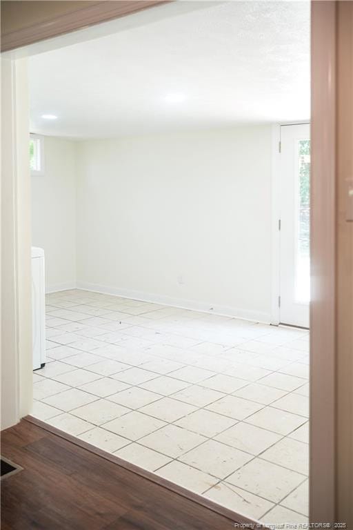 5404 S Sumac Cir, Fayetteville, NC 28304 - spare room with healthy amount of natural light and light tile patterned floors