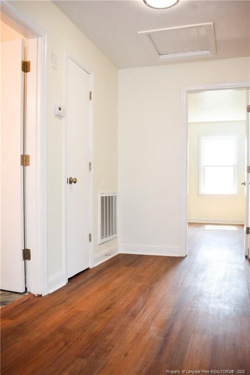 5404 S Sumac Cir, Fayetteville, NC 28304 - unfurnished room with wood finished floors and attic access