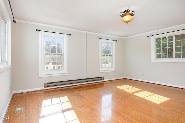 5807 Craig Rd, Durham, NC 27712 - spare room with a baseboard heating unit, wood finished floors, and ornamental molding