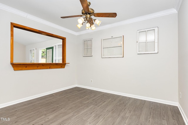 5807 Craig Rd, Durham, NC 27712 - unfurnished room with wood finished floors, a ceiling fan, and crown molding