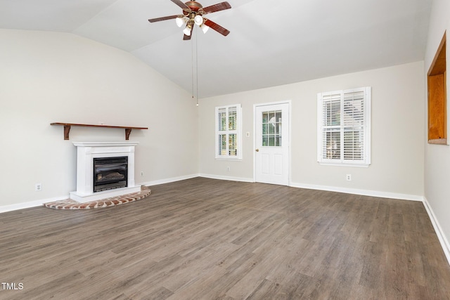 5807 Craig Rd, Durham, NC 27712 - unfurnished living room with ceiling fan, vaulted ceiling, wood finished floors, and a glass covered fireplace
