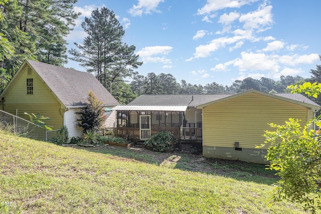 5807 Craig Rd, Durham, NC 27712 - back of property with crawl space and roof with shingles