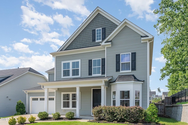 3409 Table Mountain Pine Dr, Raleigh, NC 27616 - view of front of house featuring covered porch and an attached garage