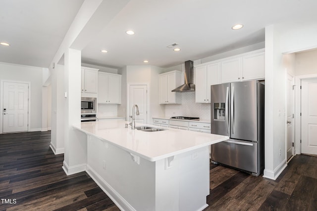 3409 Table Mountain Pine Dr, Raleigh, NC 27616 - kitchen with stainless steel appliances, wall chimney exhaust hood, dark wood-type flooring, white cabinetry, and recessed lighting