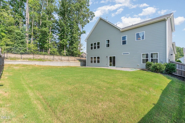 3409 Table Mountain Pine Dr, Raleigh, NC 27616 - back of house featuring a fenced backyard and a patio area
