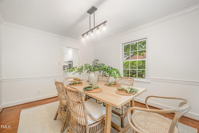 2425 Wentworth St, Raleigh, NC 27612 - dining area featuring ornamental molding and wood finished floors