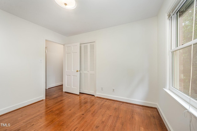 2425 Wentworth St, Raleigh, NC 27612 - unfurnished bedroom with light wood-style floors and a closet
