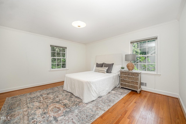 2425 Wentworth St, Raleigh, NC 27612 - bedroom featuring crown molding and hardwood / wood-style flooring