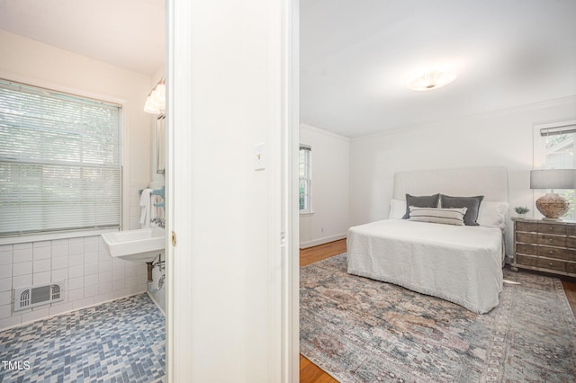 2425 Wentworth St, Raleigh, NC 27612 - bedroom featuring wood finished floors and ornamental molding