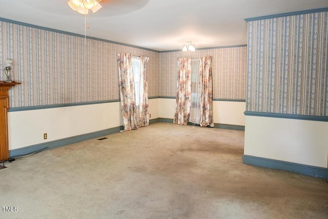 205 Forest Rd, Oxford, NC 27565 - carpeted empty room with wallpapered walls, a ceiling fan, and crown molding