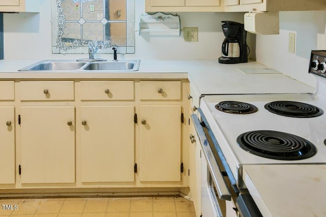 205 Forest Rd, Oxford, NC 27565 - kitchen featuring white range with electric cooktop and light countertops