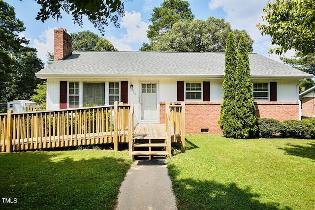 205 Forest Rd, Oxford, NC 27565 - ranch-style house with brick siding, a deck, a chimney, and a front yard
