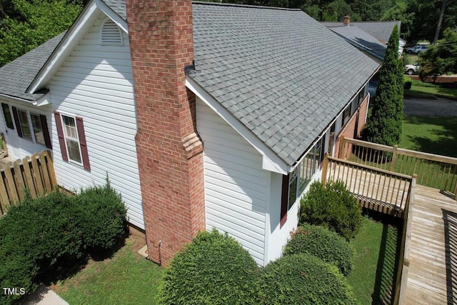 205 Forest Rd, Oxford, NC 27565 - view of side of property featuring a chimney, a deck, and roof with shingles