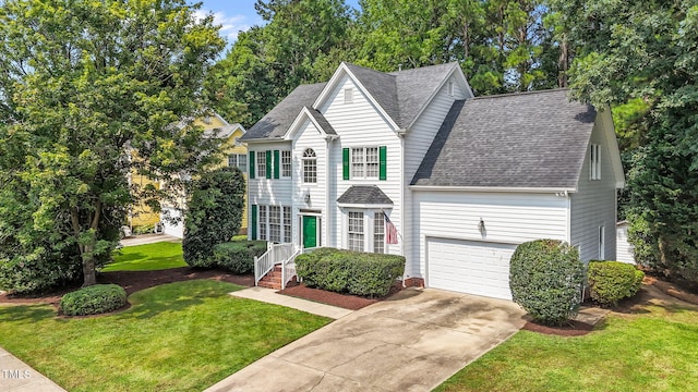 1401 Patterson Grove Rd, Apex, NC 27502 - traditional home featuring roof with shingles, concrete driveway, and a front lawn