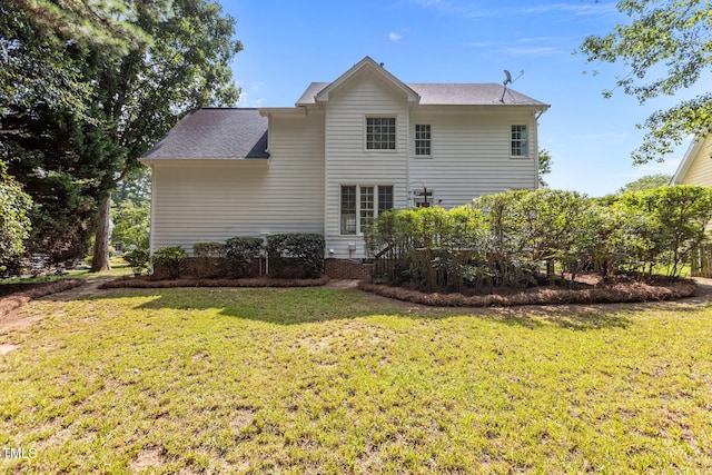 1401 Patterson Grove Rd, Apex, NC 27502 - back of property with a lawn and roof with shingles
