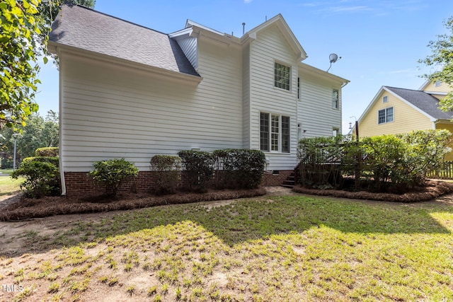 1401 Patterson Grove Rd, Apex, NC 27502 - back of property featuring a lawn and a shingled roof