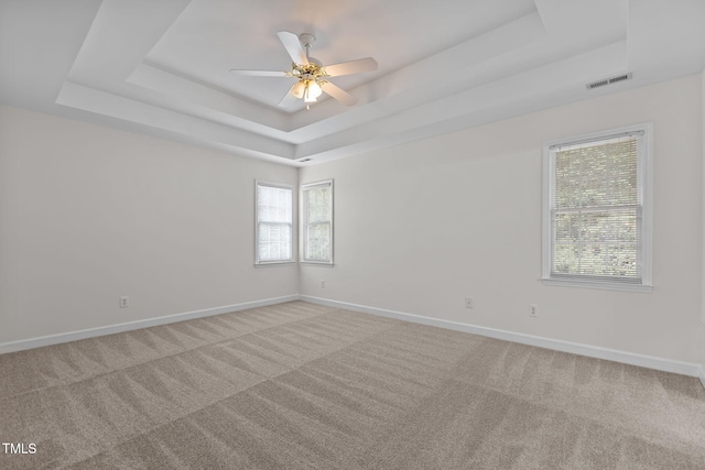 1401 Patterson Grove Rd, Apex, NC 27502 - unfurnished room featuring a tray ceiling, carpet flooring, and a ceiling fan