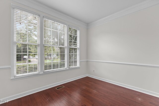 1401 Patterson Grove Rd, Apex, NC 27502 - empty room featuring healthy amount of natural light, hardwood / wood-style flooring, and crown molding