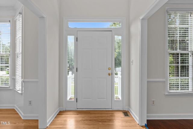1401 Patterson Grove Rd, Apex, NC 27502 - entrance foyer featuring light wood finished floors and healthy amount of natural light