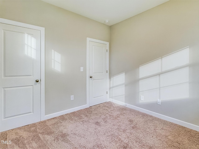 197 Delma Grimes Rd, Coats, NC 27521 - carpeted empty room with baseboards and a smoke detector