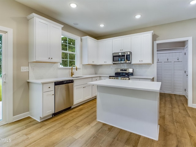197 Delma Grimes Rd, Coats, NC 27521 - kitchen featuring appliances with stainless steel finishes, light countertops, backsplash, and recessed lighting