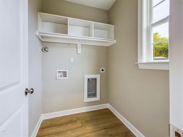 197 Delma Grimes Rd, Coats, NC 27521 - laundry room featuring electric dryer hookup, washer hookup, and wood finished floors