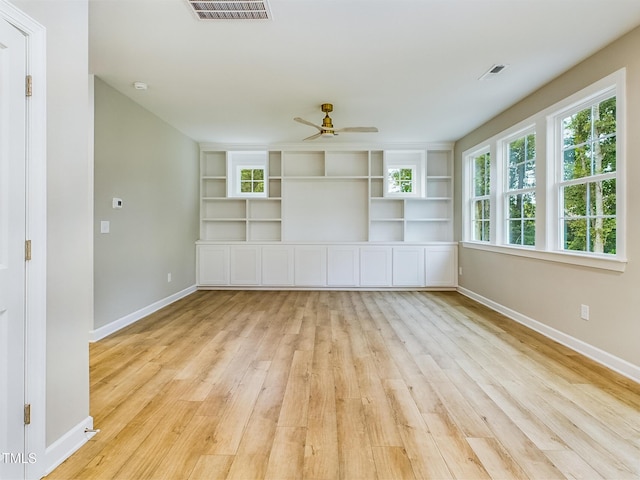 197 Delma Grimes Rd, Coats, NC 27521 - spare room featuring a ceiling fan, light wood finished floors, a smoke detector, and built in shelves