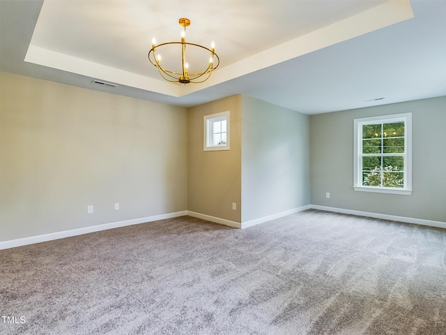 197 Delma Grimes Rd, Coats, NC 27521 - spare room with a chandelier, carpet floors, and a tray ceiling