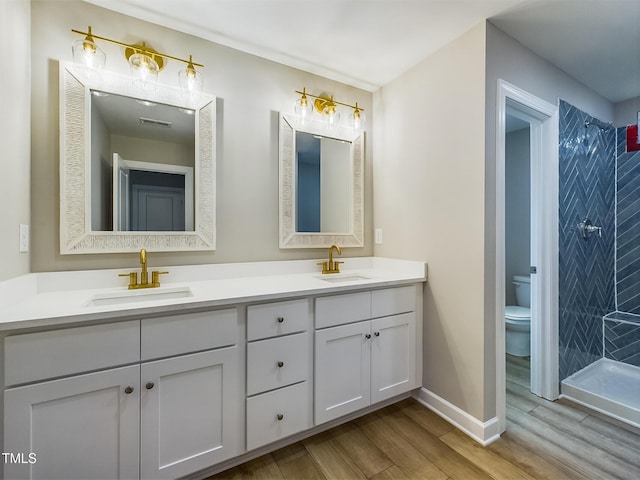 197 Delma Grimes Rd, Coats, NC 27521 - full bath featuring double vanity, wood finished floors, and tiled shower
