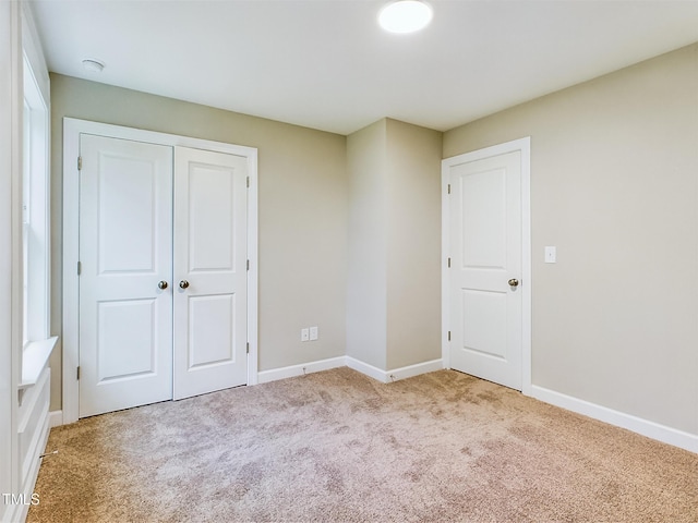 197 Delma Grimes Rd, Coats, NC 27521 - unfurnished bedroom featuring light carpet and a closet
