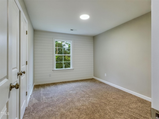 197 Delma Grimes Rd, Coats, NC 27521 - carpeted spare room with baseboards and wood walls