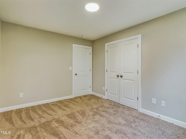 197 Delma Grimes Rd, Coats, NC 27521 - unfurnished bedroom featuring carpet floors and a closet