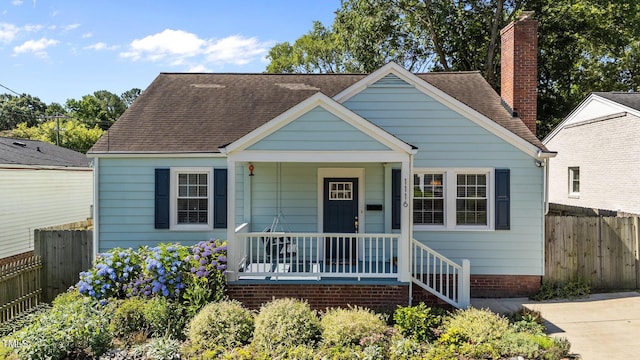 1116 E Martin St, Raleigh, NC 27610 - bungalow-style house featuring covered porch, a chimney, and roof with shingles