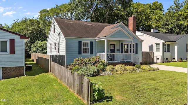 1116 E Martin St, Raleigh, NC 27610 - bungalow-style house featuring covered porch, a chimney, and roof with shingles