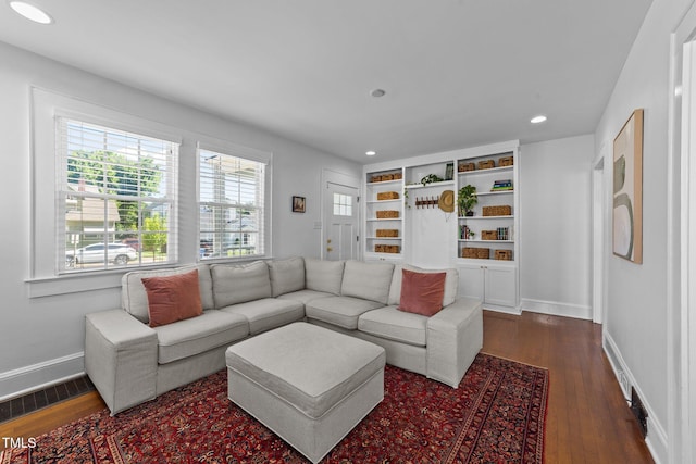 1116 E Martin St, Raleigh, NC 27610 - living room featuring dark wood-style floors and recessed lighting