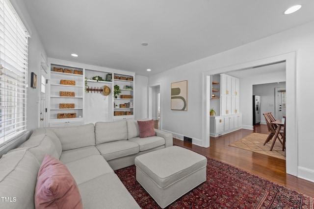 1116 E Martin St, Raleigh, NC 27610 - living area with dark wood-style flooring and recessed lighting
